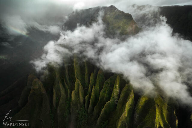 Fine art aerial photograph of Na Pali coast in moody storm light.