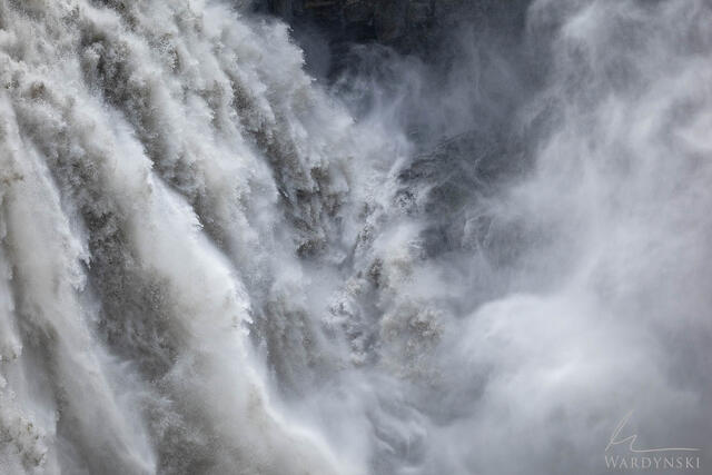 Contemporary fine art photograph of Dettifoss as water explodes onto the rocks. 