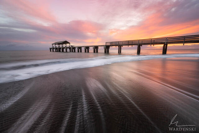 long exposure photography of the Waimea pier on Kauai Hawaii. Fine art photograph at sunset.