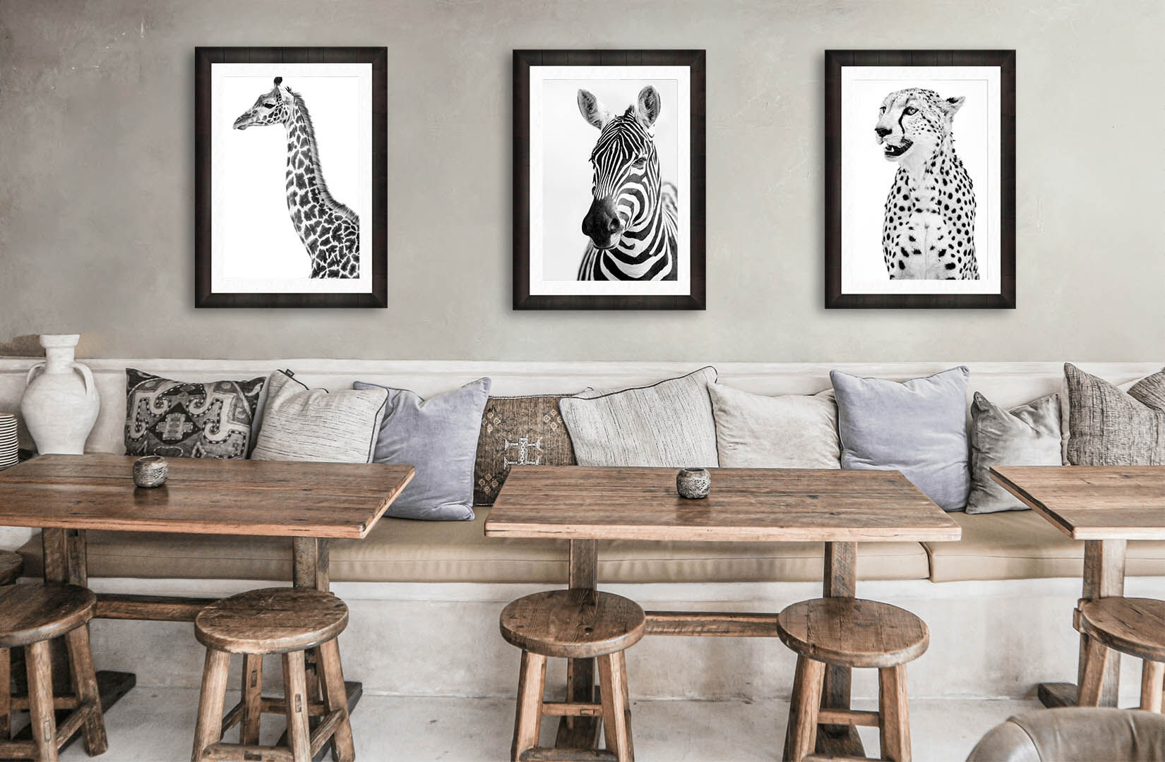Luxury African wildlife photography in black and white Three framed black and white luxury artworks with African wildlife theme hanging in modern room.
